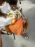 T-shirt Over Estonada Tangerina na internet