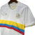 Camisa da Seleção da Colômbia 100 anos, modelo 2024, com detalhes em azul, amarelo e vermelho.