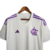 Camisa branca do Flamengo II 23/24 com detalhes em roxo, da Adidas, pendurada em um cabide.
