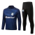 Conjunto de treino masculino do Grêmio, composto por camiseta de manga longa azul com logo e calça preta.