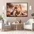 Quadro decorativo de um leão majestoso com seu filhote em um ambiente natural, exibido em uma sala moderna.