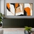 Trio de quadros abstratos com predominância da cor laranja, apresentados em um ambiente moderno.