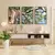 Trio de quadros decorativos com imagens de uma árvore, exibindo galhos e folhas verdes contra um céu azul.