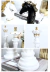Esculturas decorativas de xadrez representando um rei, uma rainha e um cavalo em branco e preto com detalhes dourados.