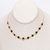CHOKER DOURADA ZIRCÔNIA PRETA - comprar online