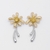 Brinco Flor Dourado com Prateado - comprar online