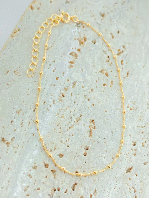 TORNOZELEIRA BOLINHAS DOURADAS FOLHADO A OURO