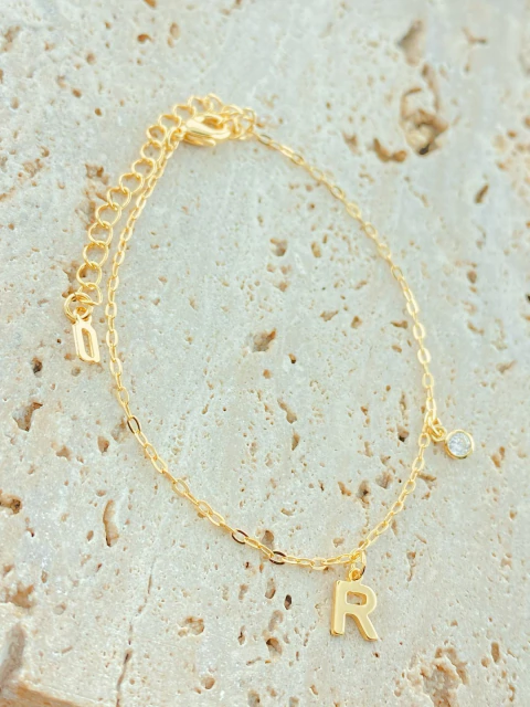 PULSEIRA LETRA COM PONTO DE LUZ FOLHADO A OURO-R