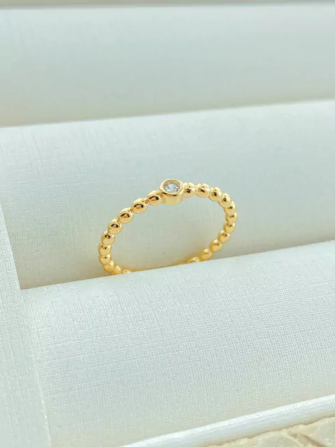 ANEL BOLINHAS DOURADAS COM PONTO DE LUZ NO CENTRO FOLHADO A OURO