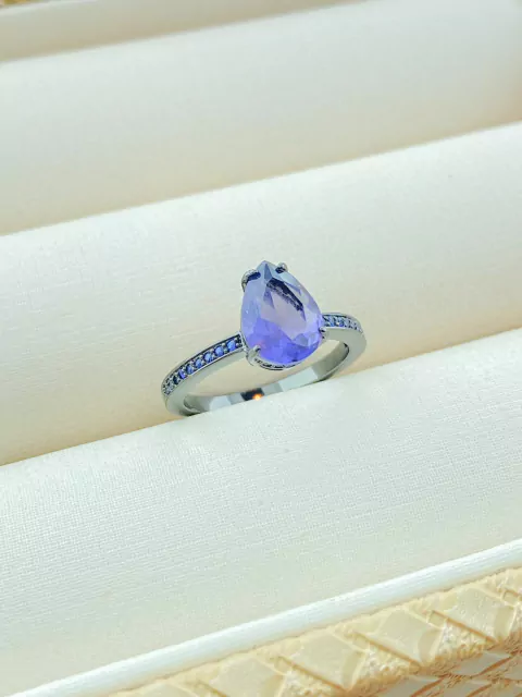 ANEL GOTA LILÁS COM ZIRCONIAS AZUL RÓDIO NEGRO