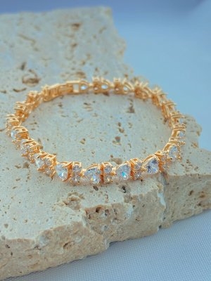 PULSEIRA RIVIERA CORAÇÕES COM PONTOS DE LUZ FOLHADO A OURO