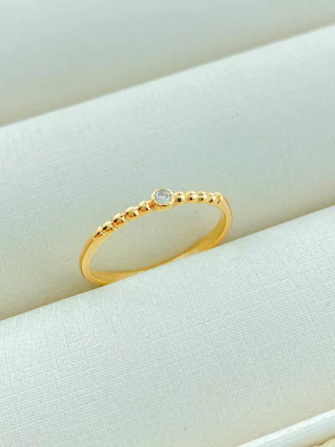 ANEL BOLINHAS DOURADAS COM PONTO DE LUZ CENTRALIZADO FOLHADO A OURO