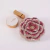 Bolsa Vichy com design floral, decorada com pedras brilhantes em rosa e branco, ideal para festas e casamentos.