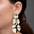 Brinco Círculos P M G com Textura Folheado a Ouro 18k - comprar online
