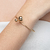 Pulseira Torcida com 2 Bolas Folheado a Ouro 18k - comprar online