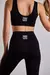 calza deportiva lisa negra para mujer con tiro alto .  ideal para el gimnasio . calce perfecto y costuras reforzadas . 