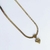 COLAR FITA COM PINGENTE CORAÇÃO DOURADO COD: 0625 - Linha Radiante