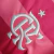 Camisa Flamengo Retrô Outubro Rosa 2022, masculina, em rosa com listras em dois tons e símbolo do Flamengo em branco.
