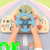 Painel sensorial de madeira para crianças com volante azul, botões, alavancas e mostradores simulando painel de carro, da marca tooky toy