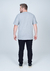 Camiseta Plus Size Básica Lisa 100% Algodão na cor cinza vista de costas.