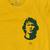 Camiseta amarela com estampa do rosto de Zico, jogador de futebol, e o número 10 abaixo.