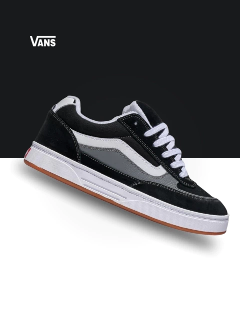 Tênis Vans Estazzo Skate na cor preto e branco, com detalhes em cinza e sola de borracha.