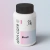 Frasco branco de suplemento alimentar Biosil da linha Alm Care com tampa preta, com design clean e rótulo em tons pastel rosa e azul, focado em beleza e saúde da mulher
