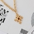 COLAR CRUZ MARROM BOHO - OURO