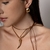 COLAR DE COURO BOHO COM PINGENTE NO OURO na internet