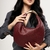 BOLSA TRESSE ALÇA METAL