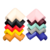 Cubre esquineros de distintos colores para muebles y mesas, apilados en forma de pirámide.