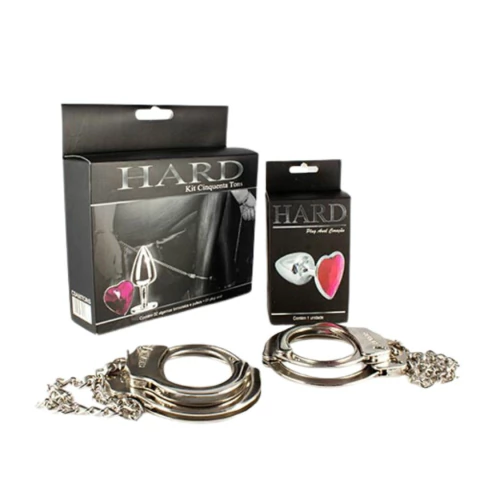 Par de Algemas e Tornozeleiras em Metal com Chave de Segurança e Plug Anal com Pedra De Coração - HARD Cinquenta Tons