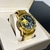 Justiçeiro Dourado/Preto - comprar online