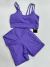 Conjunto fitness de poliamida short com bolso e top com bojo Lilás - Vitória Régia