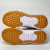 Solado do Tênis Vans Ultraranger na cor cinza e branco, destacando a parte de borracha laranja e detalhes em branco.