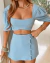 Conjunto Cropped com Manga Bufante e Short Saia com Botões - Loja Amora