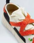 Tenis Branco e Laranja OSKLEN na internet