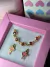 CONJUNTO DE BRINCO BAILARINA E PULSEIRA BANHADO A OURO - comprar online
