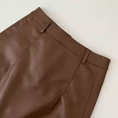 Saia Bodycon de couro PU feminina, botões vintage, bolso com zíper, versátil, cintura alta, fina, curta, sólida, linha A, verão, novo - Wolf Magazine
