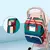 Mochila cuna maternal con techo y cargador puerto USB - Turquesa en internet
