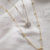 Mix de Colar Longo Corrente Bolinha e Colar Chuveirinho Banhado a Ouro 18K - comprar online