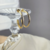 Brinco Argola Média Trabalhada no Ródio Branco Banhada a Ouro 18K