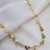 Choker com Mini Corações Vazados e de Pérolas Banhado a Ouro 18K