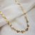 Choker com Mini Corações Vazados e de Pérolas Banhado a Ouro 18K - comprar online