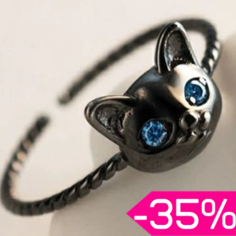 Anillo negro con cara de gatito y ojitos azules, diseño delgado. Con descuento.