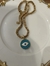 Colar em dorado,38 cm mais alongador, com olho grego esmaltado na cor azul turquesa.