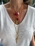 Colar em dourado, curto com alongador com olho grego e coral. - comprar online