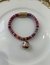 Pulseira com fecho de imã, fio indiano rosa com bola rosa. - comprar online