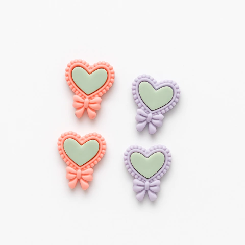 Charm Corazones con moño resina mates X4 - comprar online