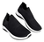 Zapatillas elastizadas Wake de color negro con suela blanca, diseño moderno y cómodo.